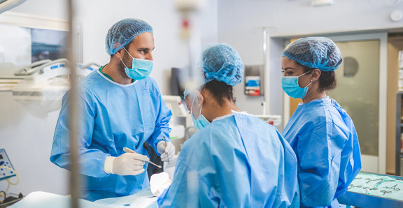 Doctor Operating Room With Nurses