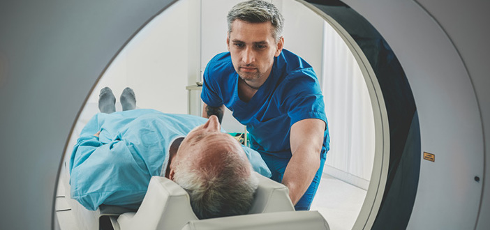Scan Technologist Overlooking Patient Ct Scanner